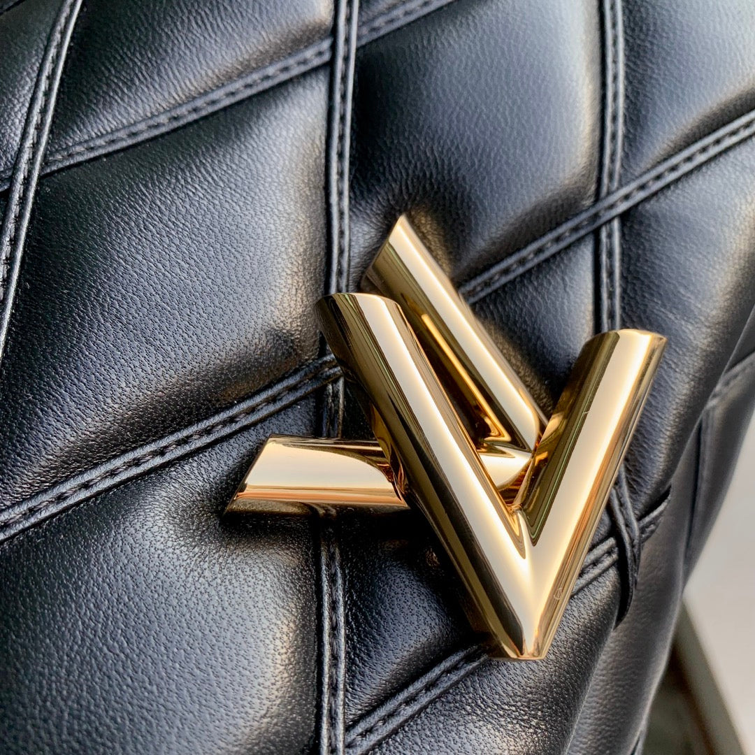 Louis Vuitton Quilted Black Leather Top Handle Handbag with Gold Metal Clasp