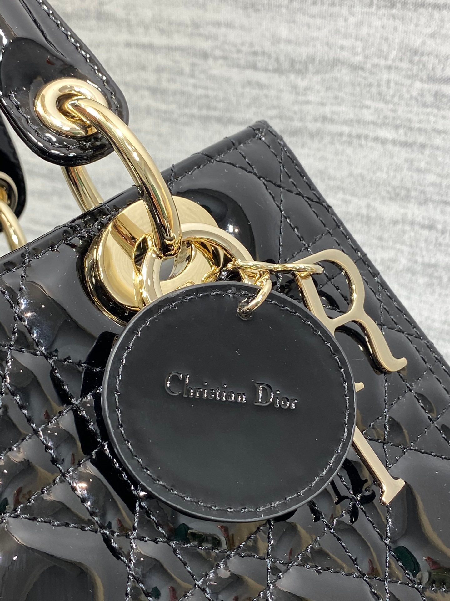 Dior Elegant Black Quilted Patent Leather Mini Handbag with Gold Hardware