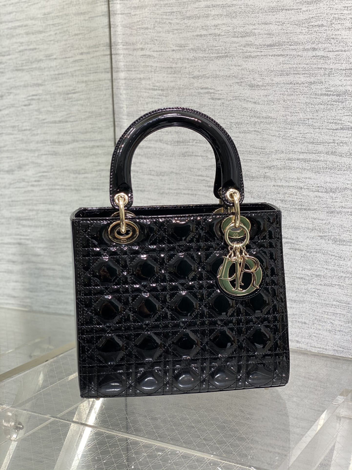 Dior Elegant Black Quilted Patent Leather Mini Handbag with Gold Hardware