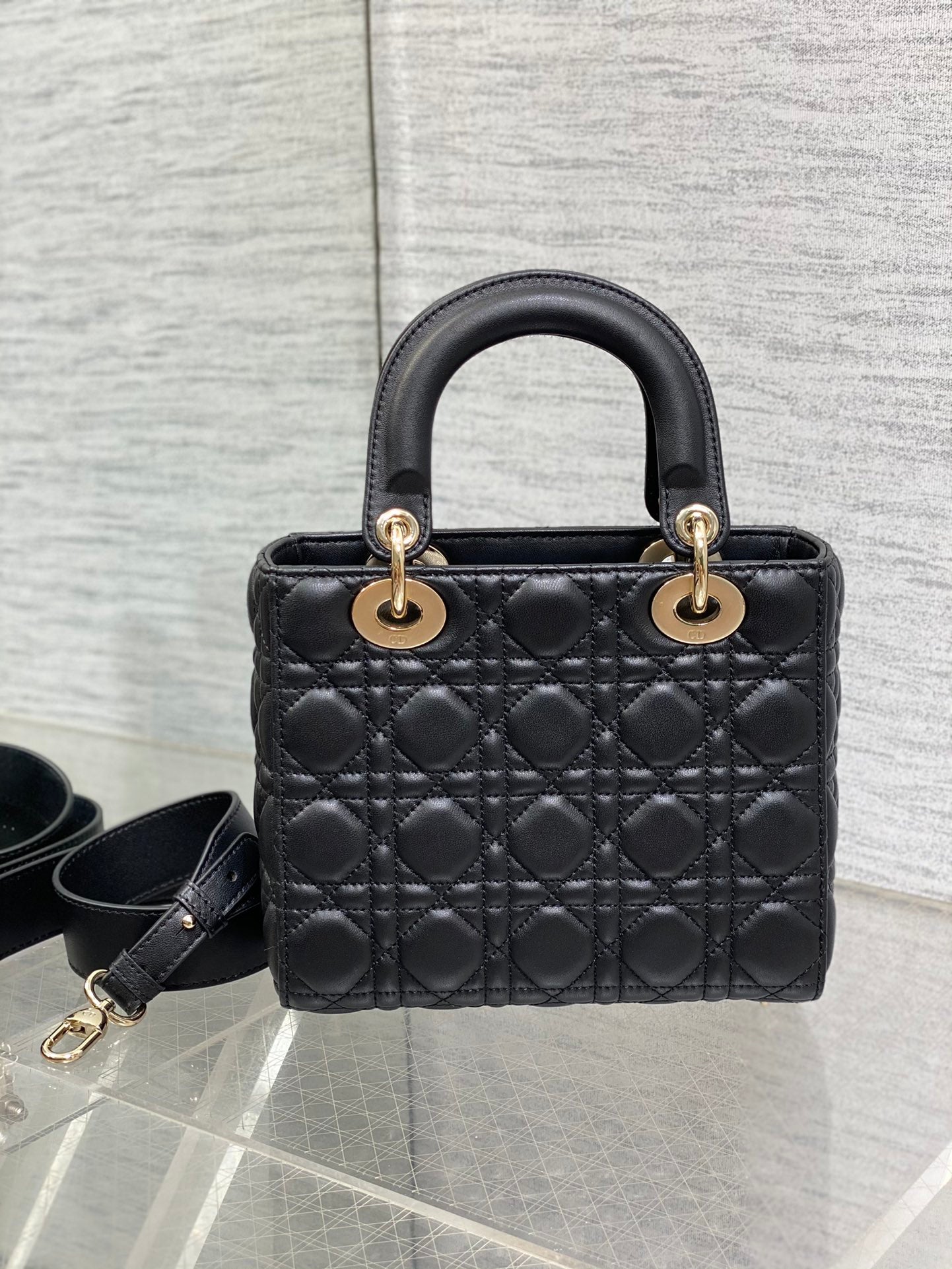 Dior Elegant Black Quilted Leather Handbag with Gold Hardware