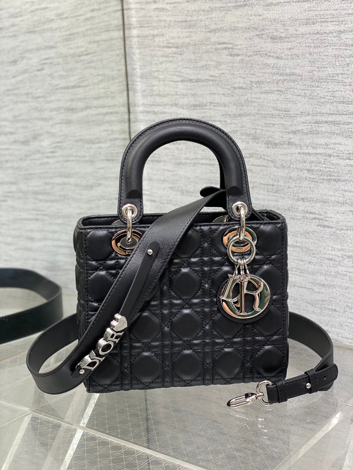 Dior Elegant Black Quilted Leather Handbag with Top Handles and Strap