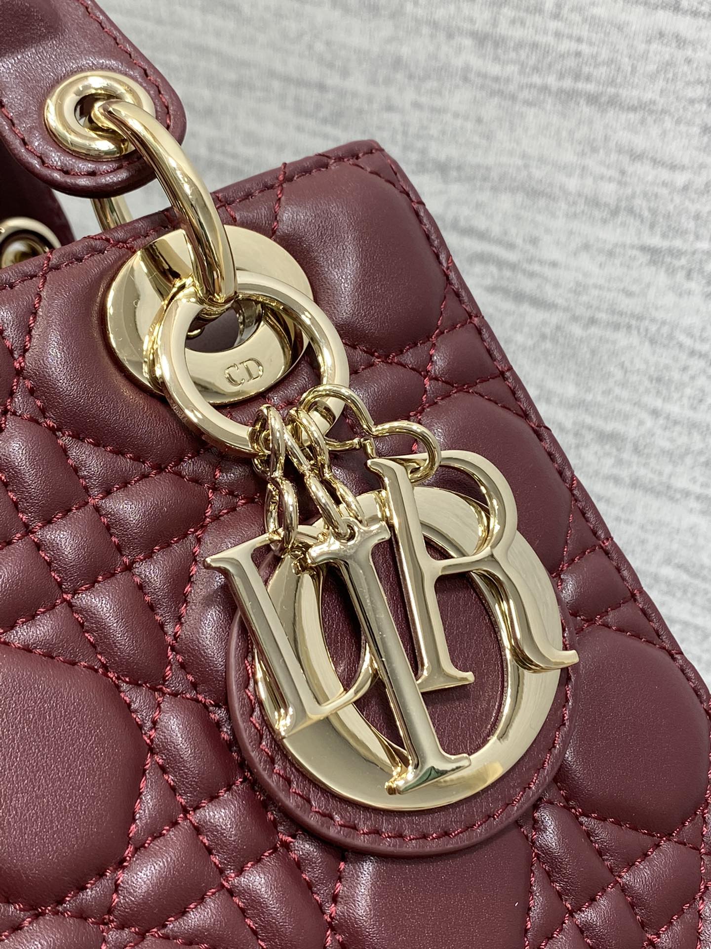 Dior Burgundy Quilted Leather Top Handle Handbag with Crossbody Strap