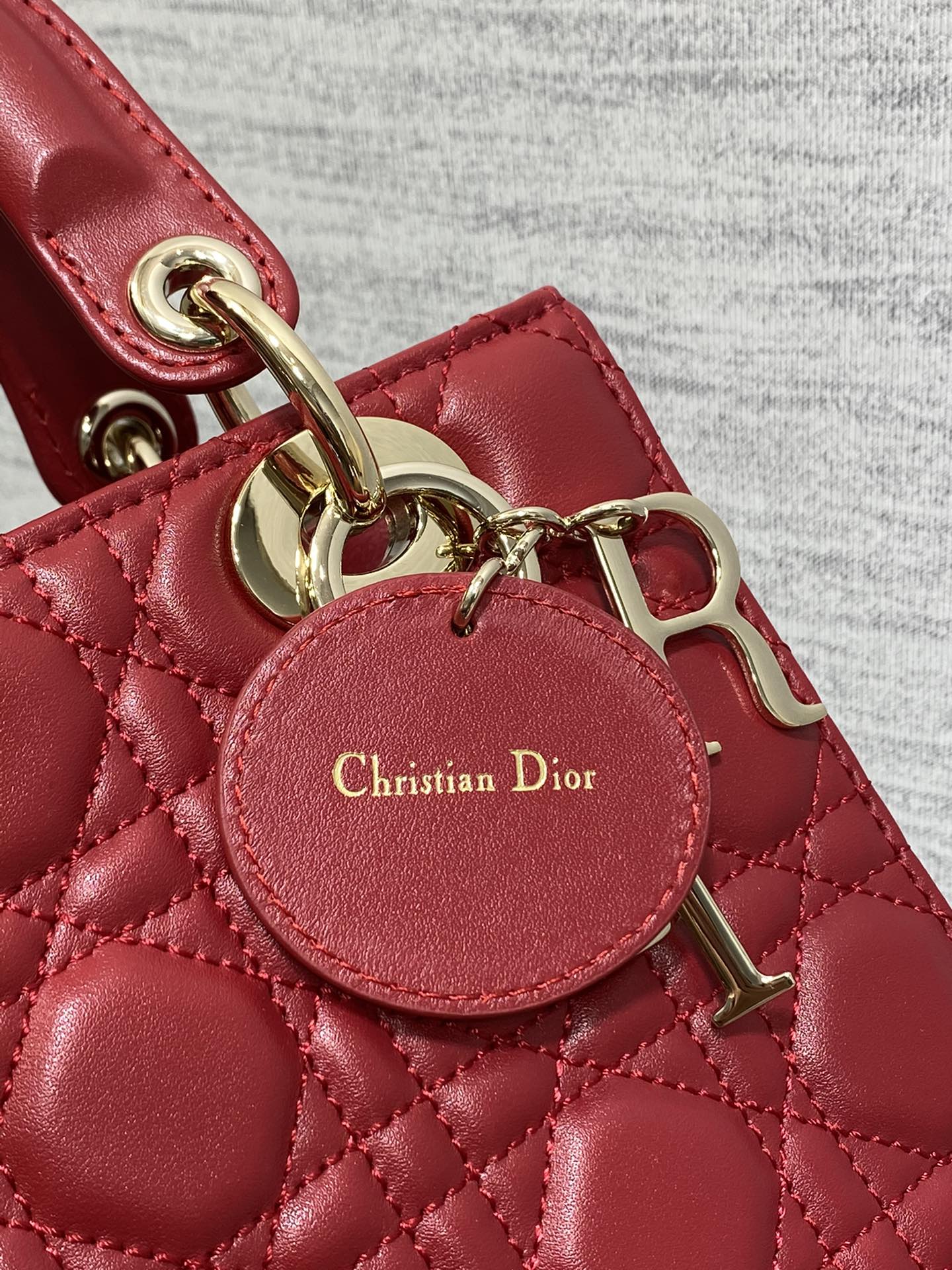 Dior Red Quilted Leather Top Handle Bag with Gold Charms and Crossbody Strap