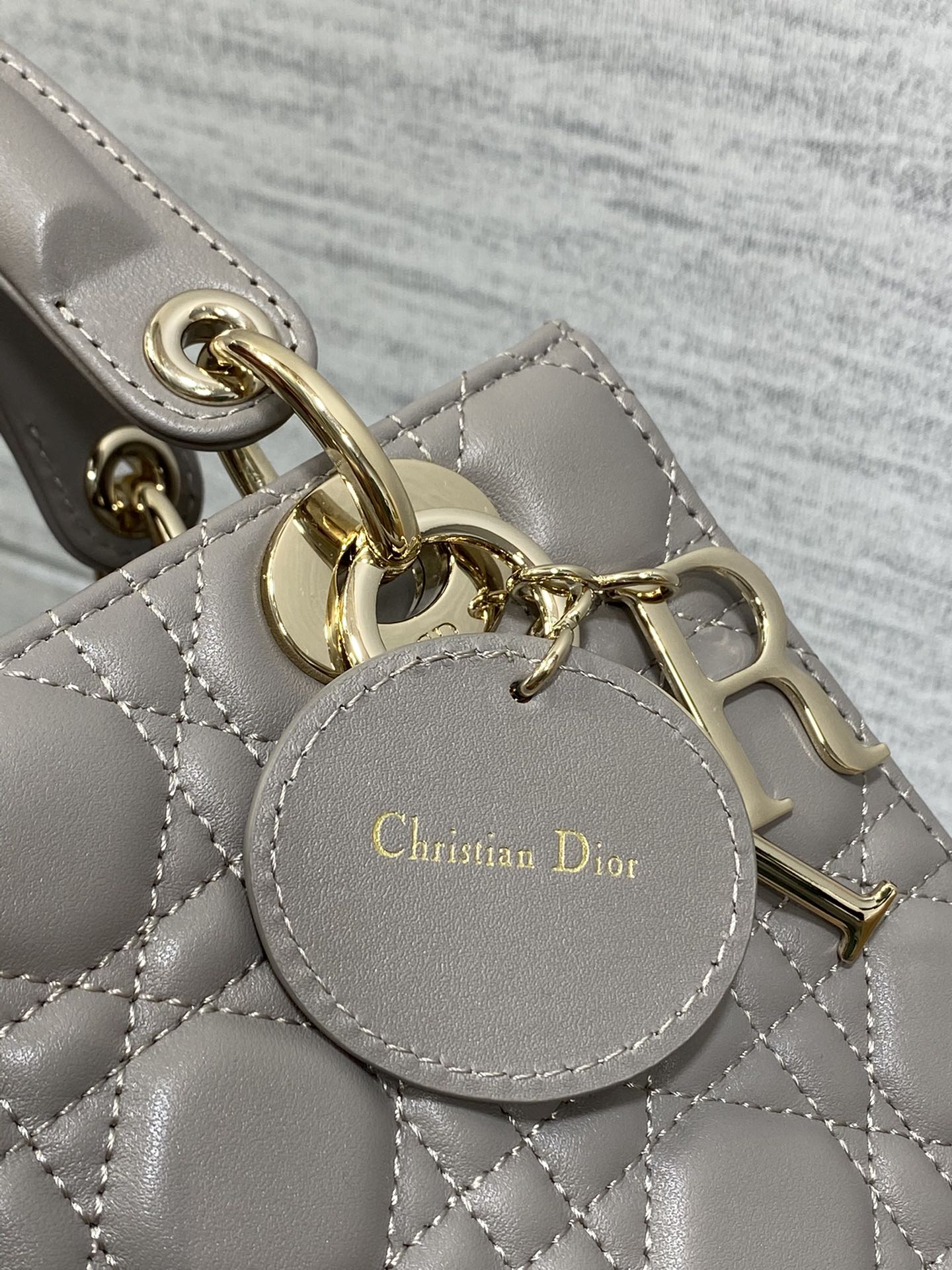 Dior Elegant Grey Quilted Leather Top Handle Bag with Crossbody Strap