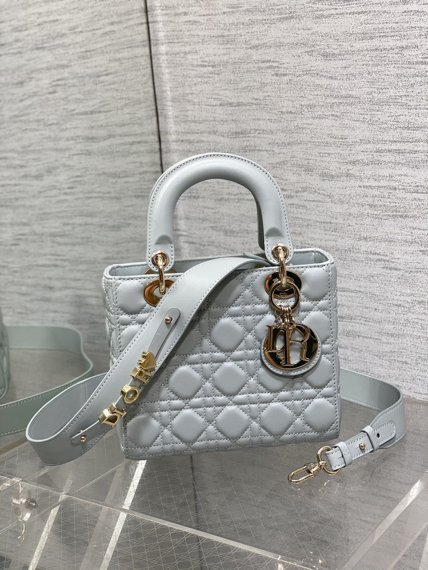 Dior Light Blue Quilted Leather Handbag with Gold Charms and Strap
