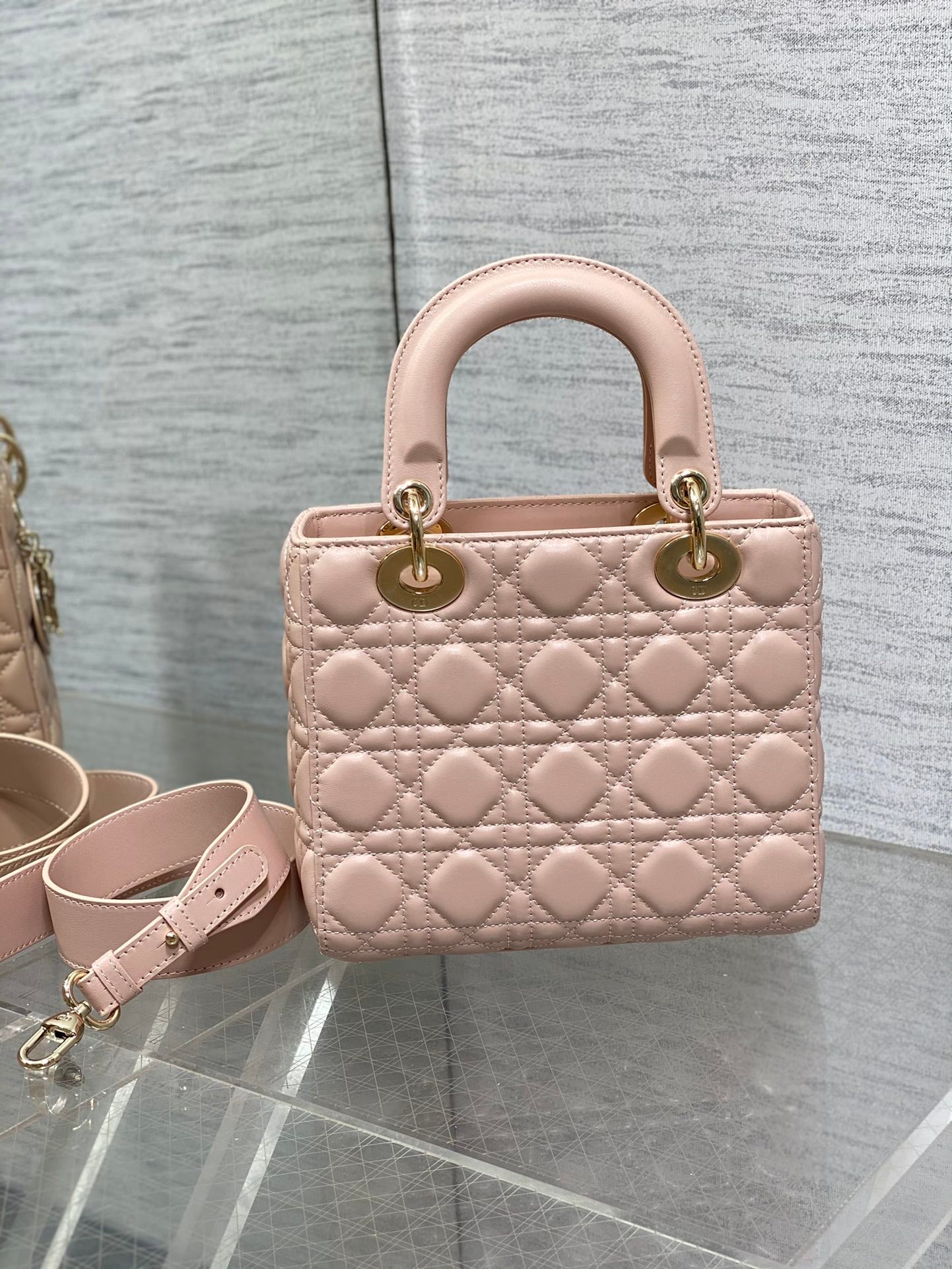 Dior Luxury Quilted Pale Pink Leather Handbag with Gold Hardware and Strap