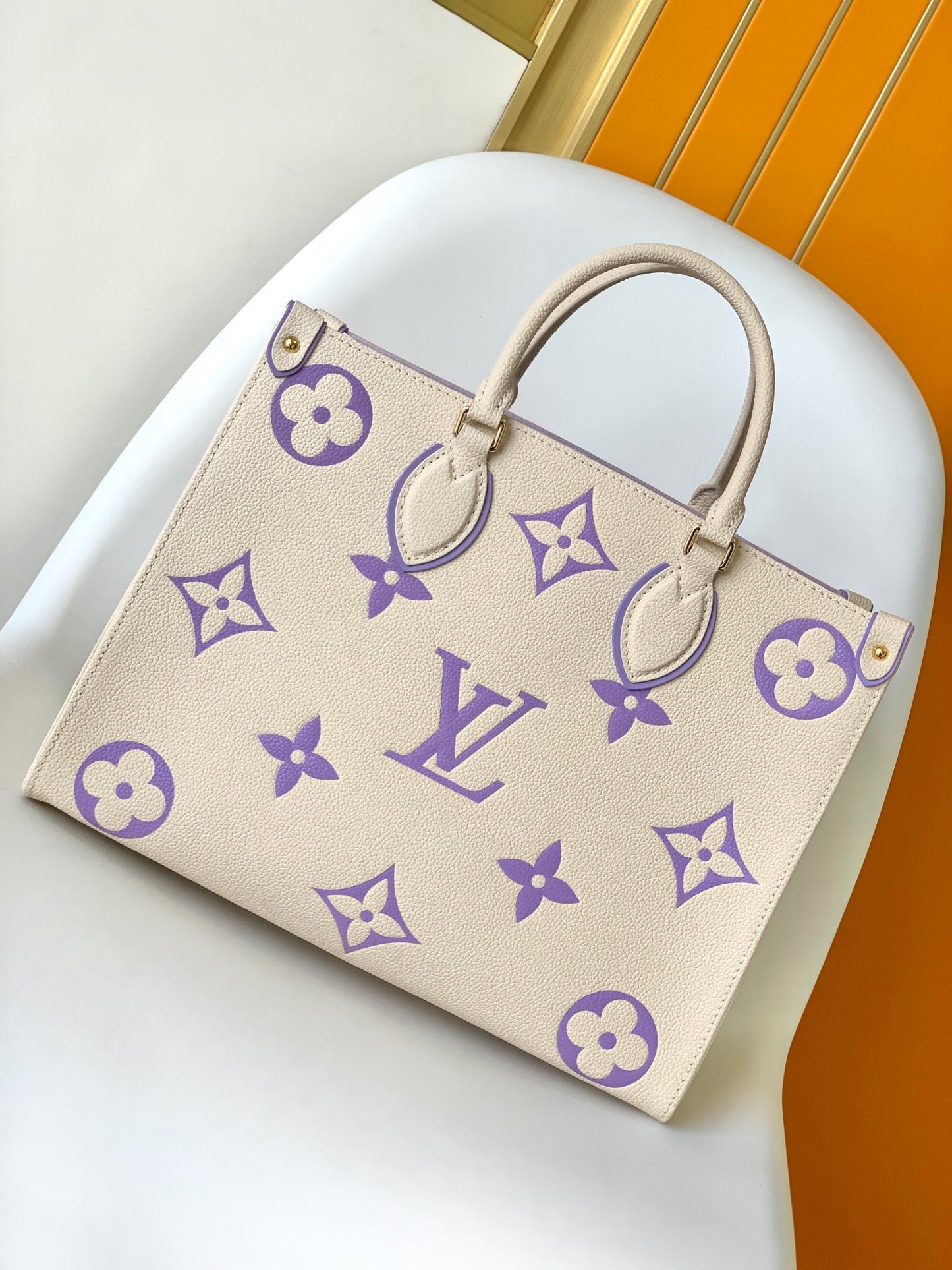 Louis Vuitton Elegant Cream Leather Tote Bag with Purple Monogram Print