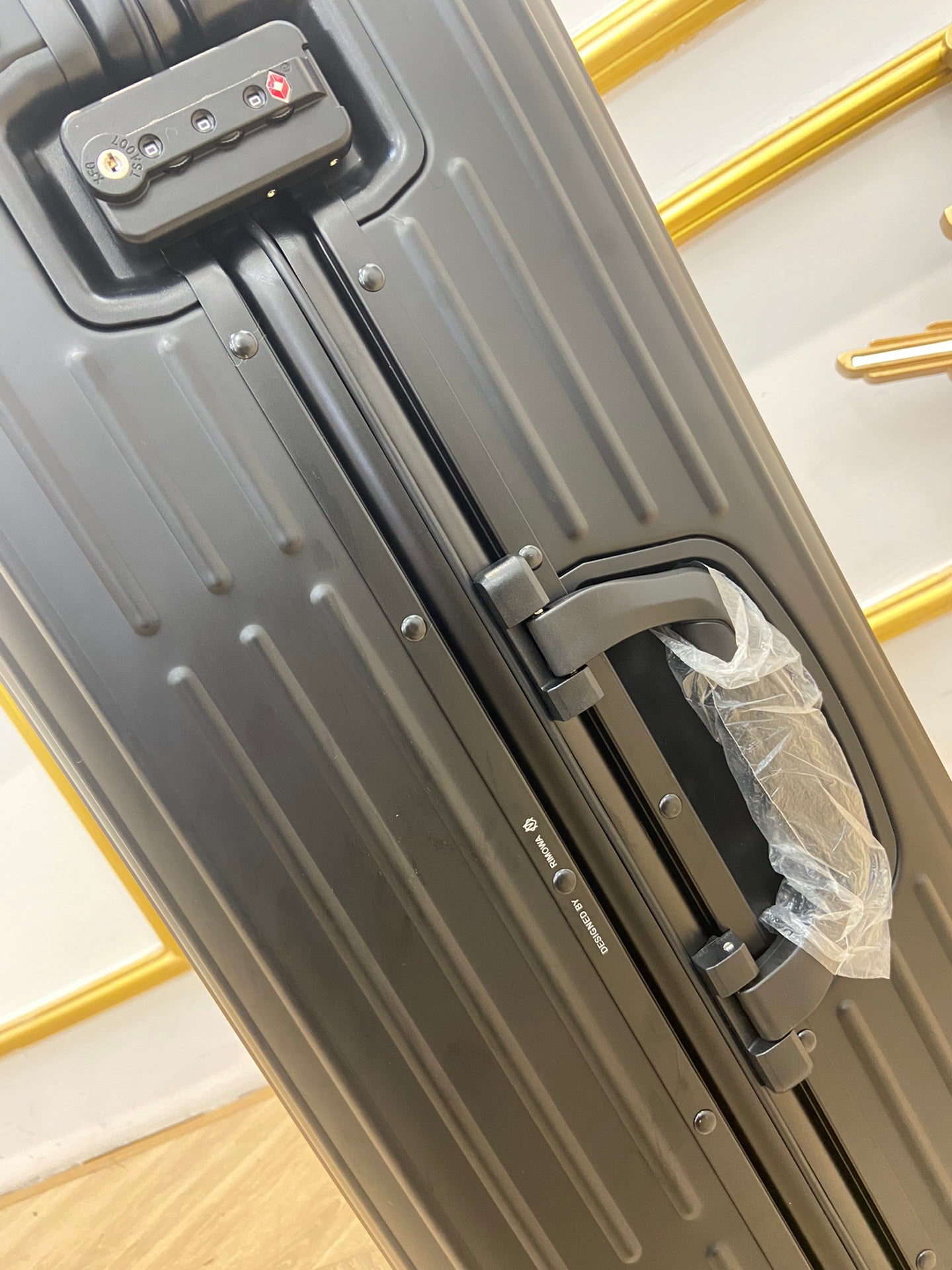 Sleek Matte Black Ribbed Hardside Spinner Travel Suitcase