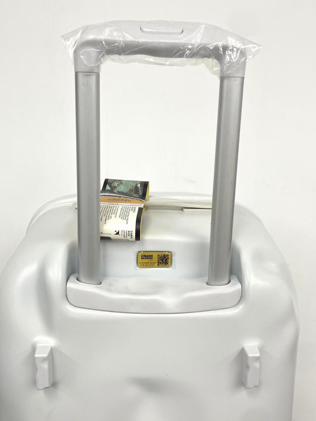 Modern Glossy White Dented Hardshell Spinner Suitcase
