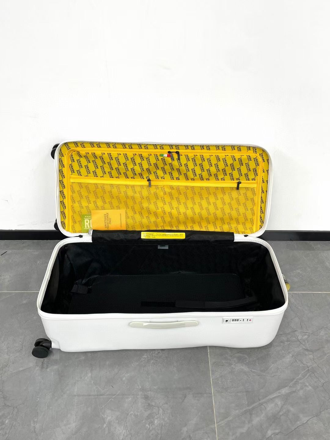 Modern Glossy White Dented Hardshell Spinner Suitcase