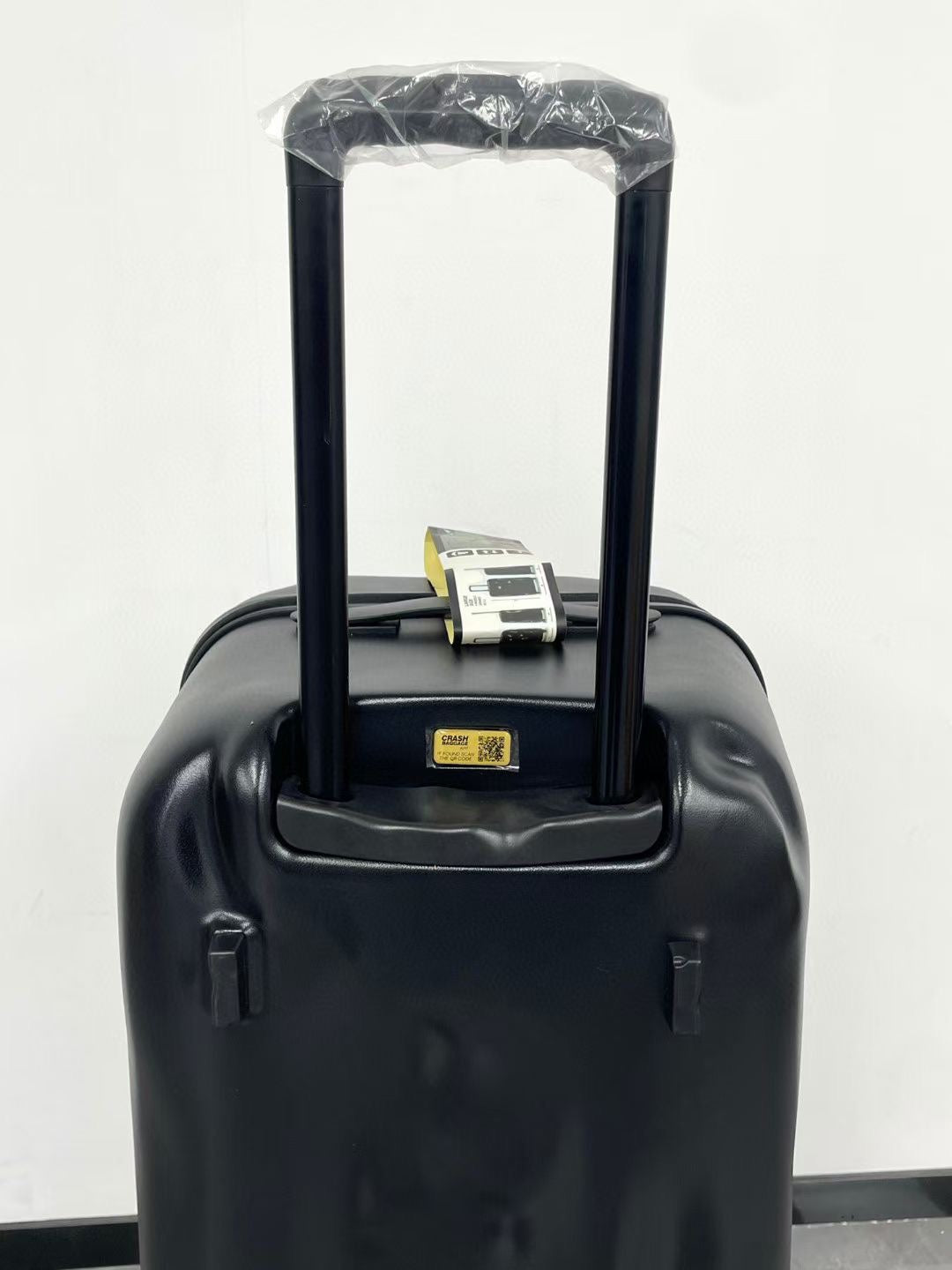 Black Spinner Carry-On Luggage with Yellow Accent Strap