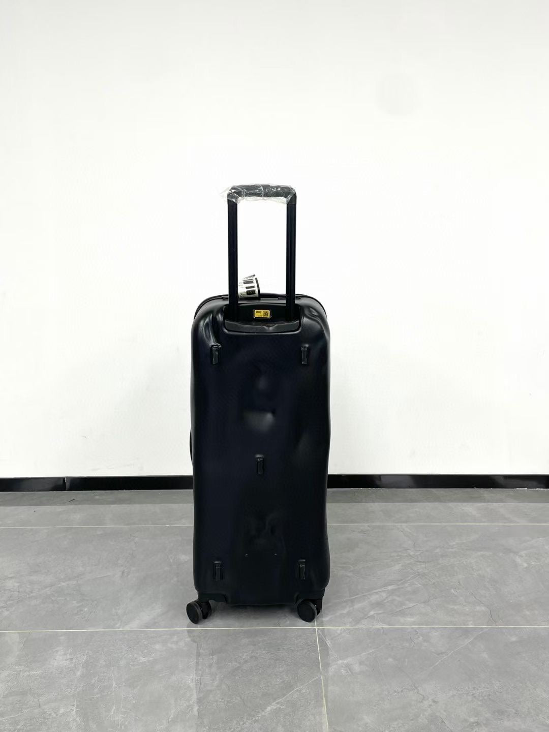 Black Spinner Carry-On Luggage with Yellow Accent Strap