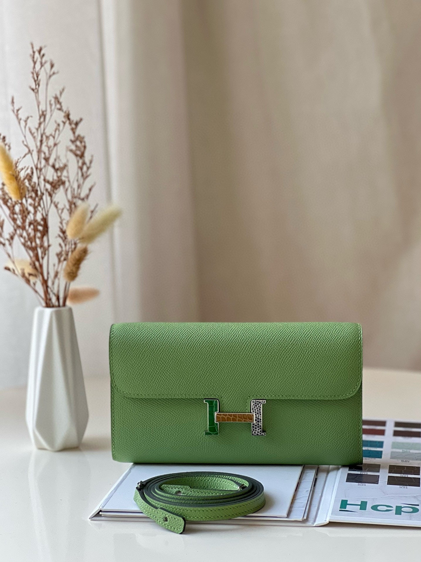 Elegant Cream Leather Crossbody Bag with Gold H-Logo Clasp