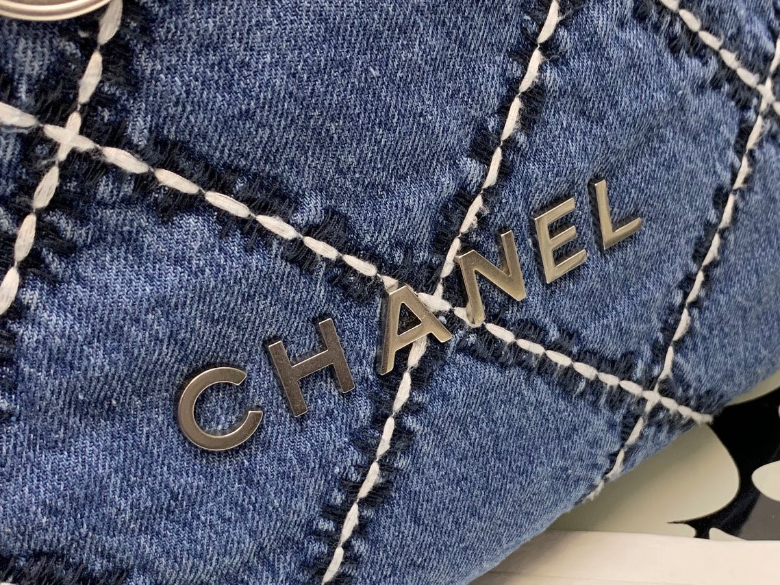 Chanel Quilted Denim Drawstring Bag with Silver-Tone Chain