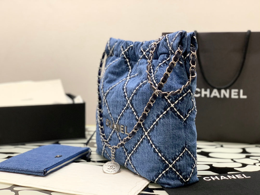 Chanel Quilted Denim Drawstring Bag with Silver-Tone Chain