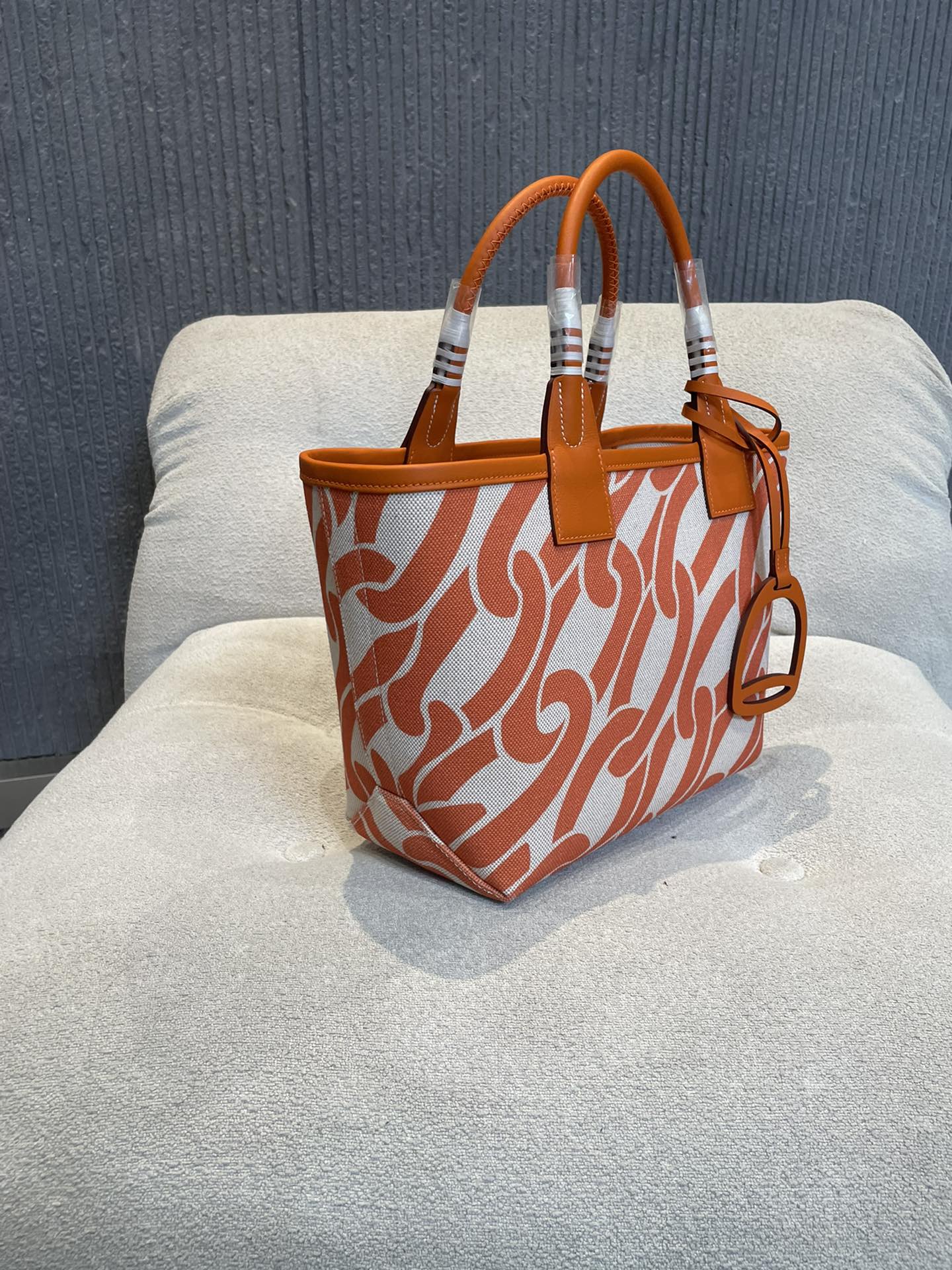 Orange Chain Link Pattern Canvas Tote Bag with Leather Top Handles and Stirrup Charm