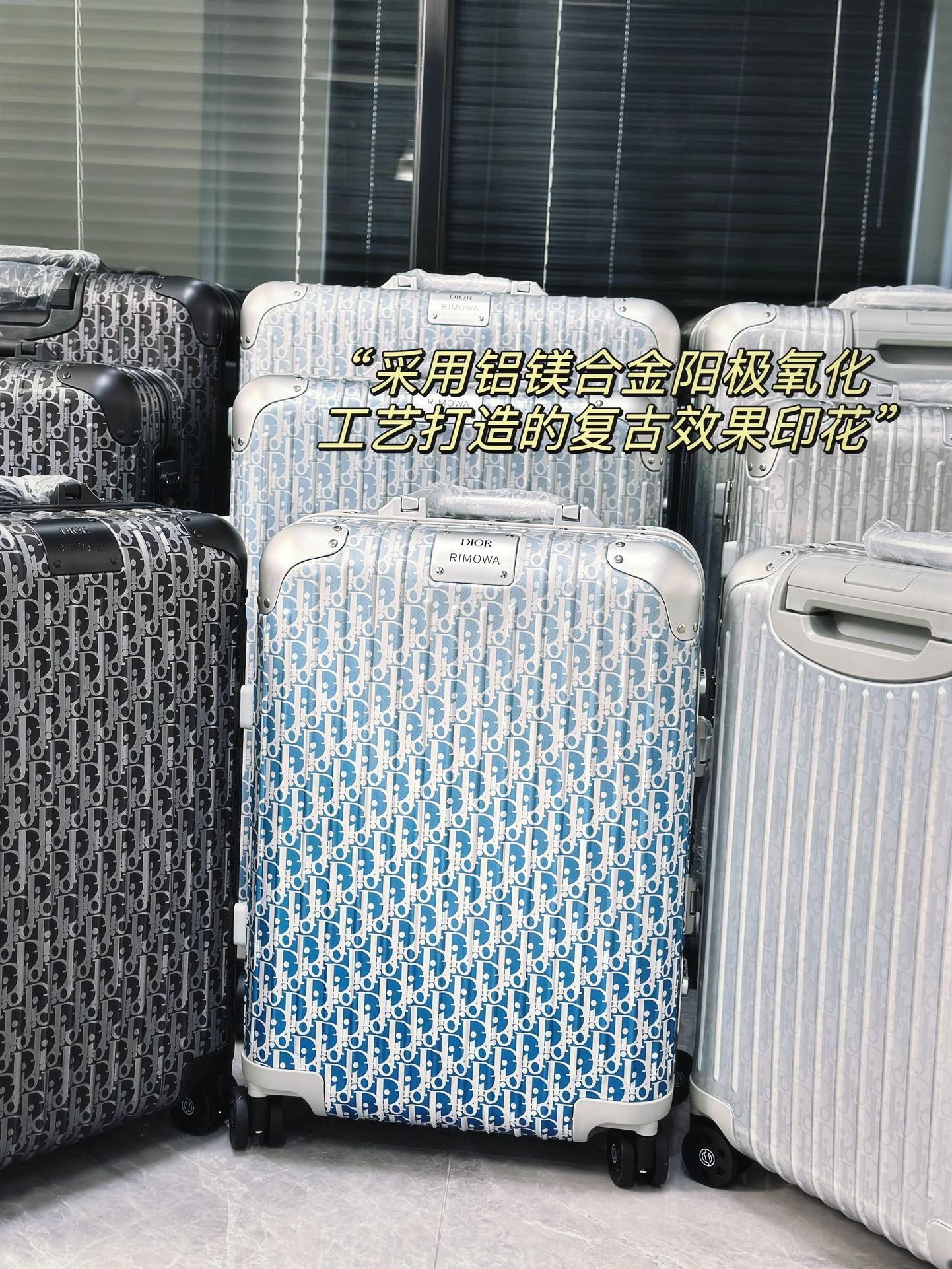 Silver Aluminum Hardside Spinner Suitcase with Monogram Pattern