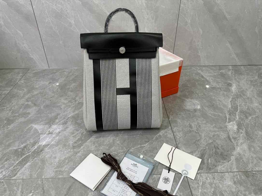 Designer-Inspired Grey and White Striped Canvas Handbag with Black Leather Flap