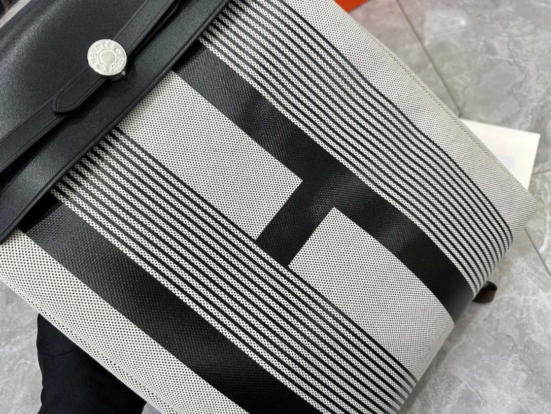 Designer-Inspired Grey and White Striped Canvas Handbag with Black Leather Flap