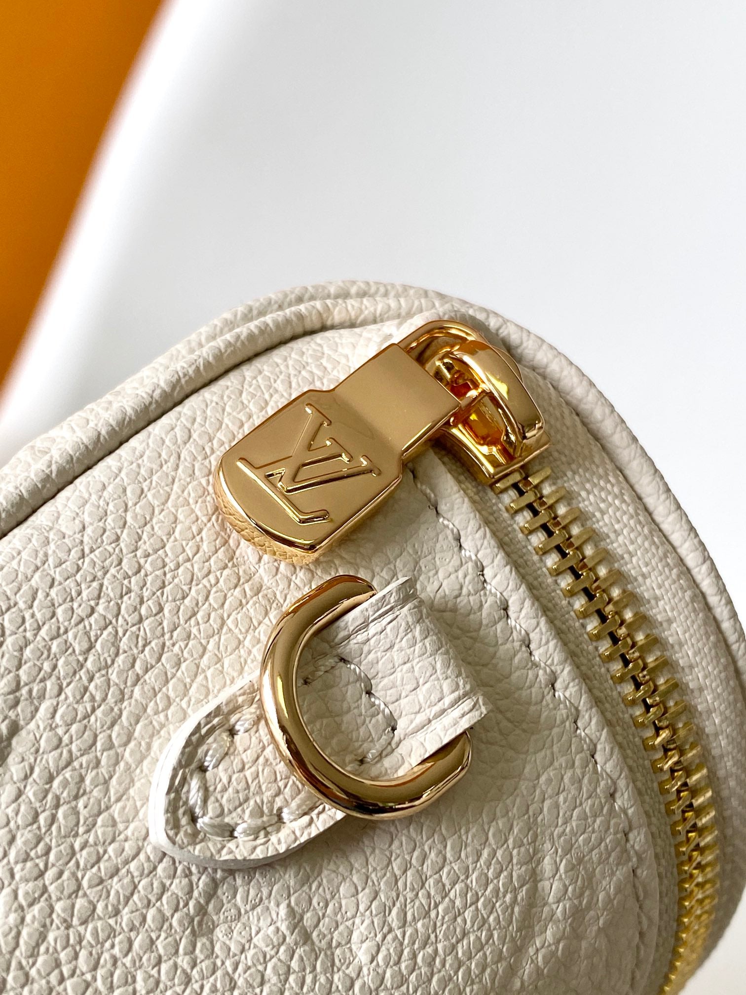 Louis Vuitton Elegant Cream Embossed Leather Crossbody Bag with Gold Chain