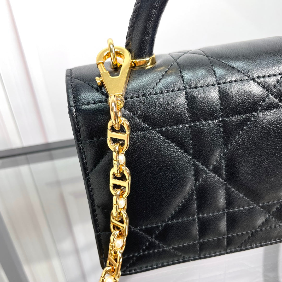 Black Quilted Leather Top Handle Handbag with Gold-Tone Hardware
