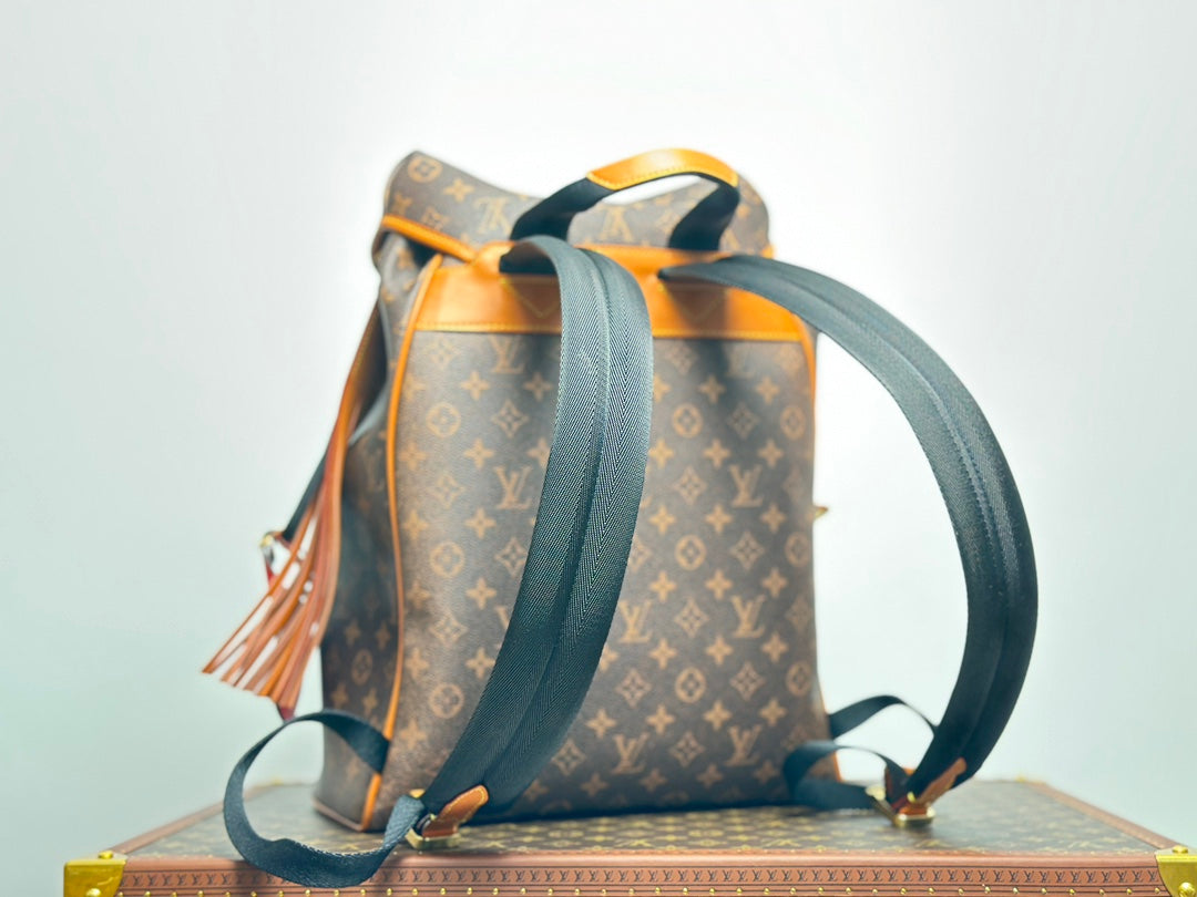 Louis Vuitton Vintage Monogram Pattern Leather Backpack with Buckle and Tassel