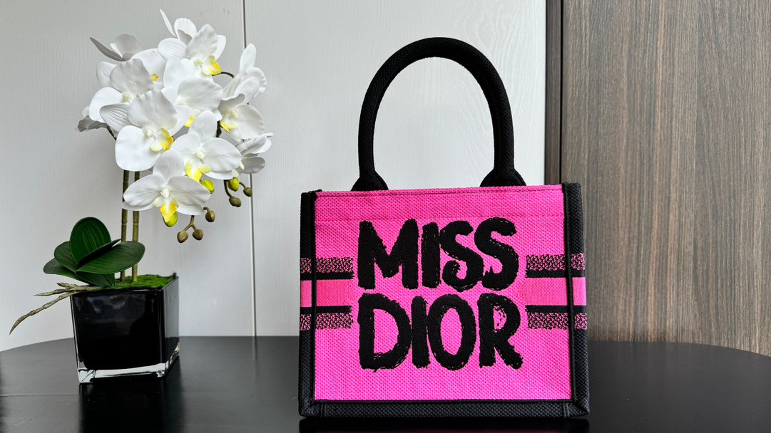 Dior Vibrant Pink Canvas Tote Bag with Bold Black Lettering and Top Handles