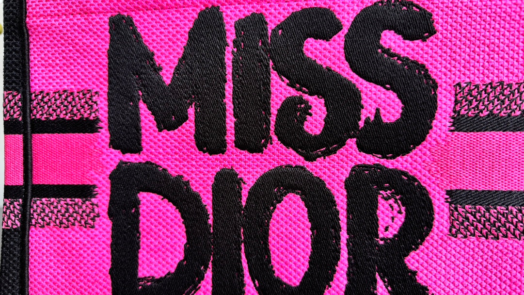 Dior Vibrant Pink Canvas Tote Bag with Bold Black Lettering and Top Handles
