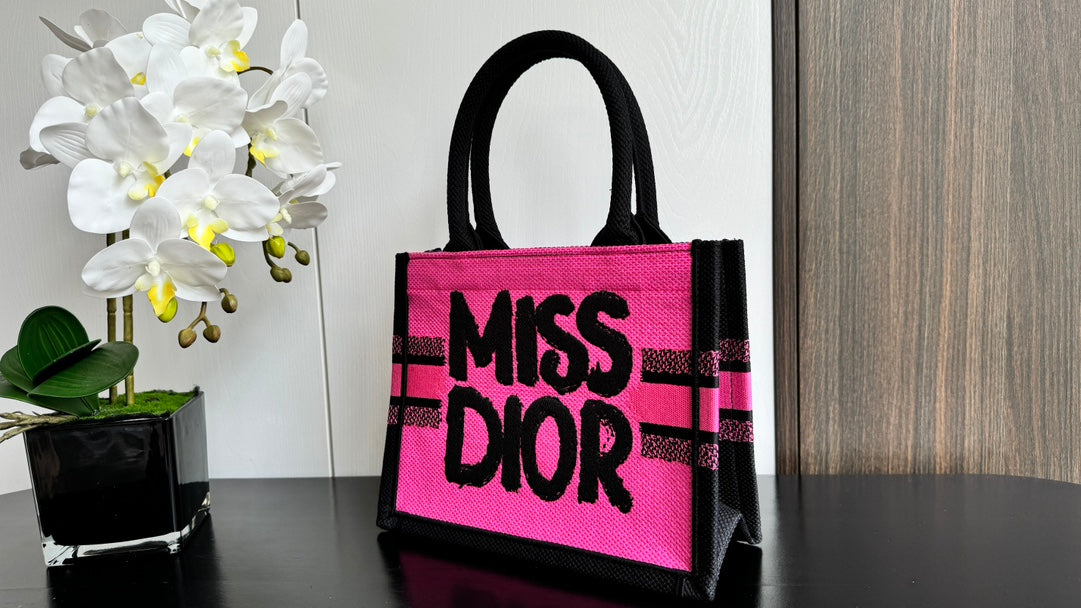 Dior Vibrant Pink Canvas Tote Bag with Bold Black Lettering and Top Handles