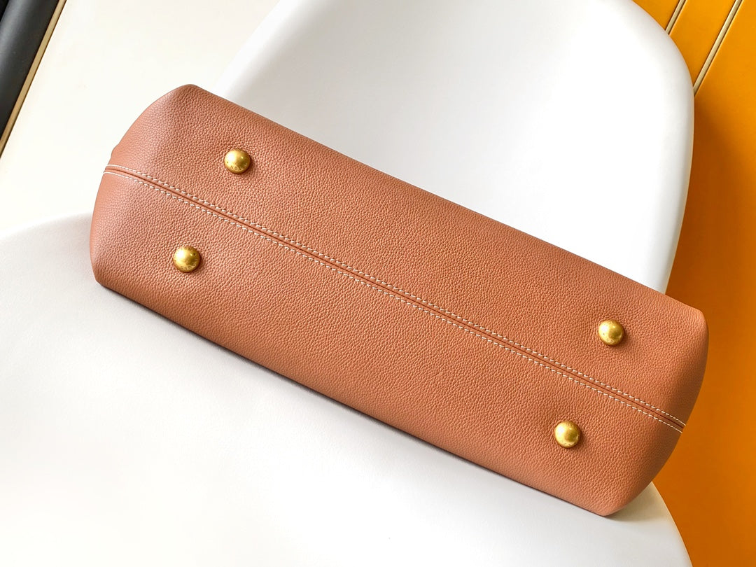 Louis Vuitton Classic Brown Leather Tote Bag with Gold Lock Accent and Shoulder Straps