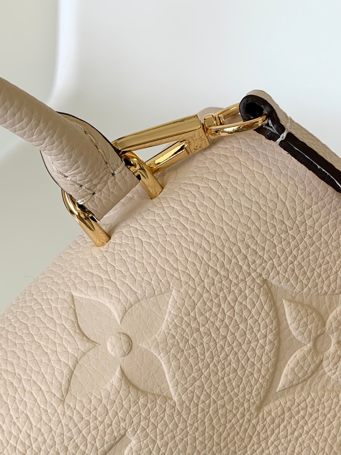 Louis Vuitton Elegant Cream Embossed Leather Top Handle Handbag with Shoulder Strap