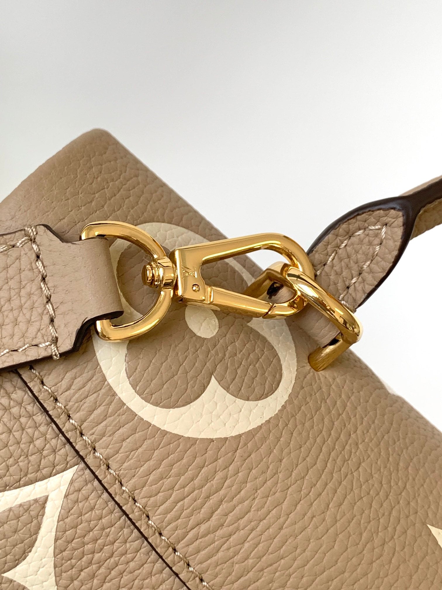 Louis Vuitton Elegant Beige Monogram Embossed Leather Top Handle Handbag