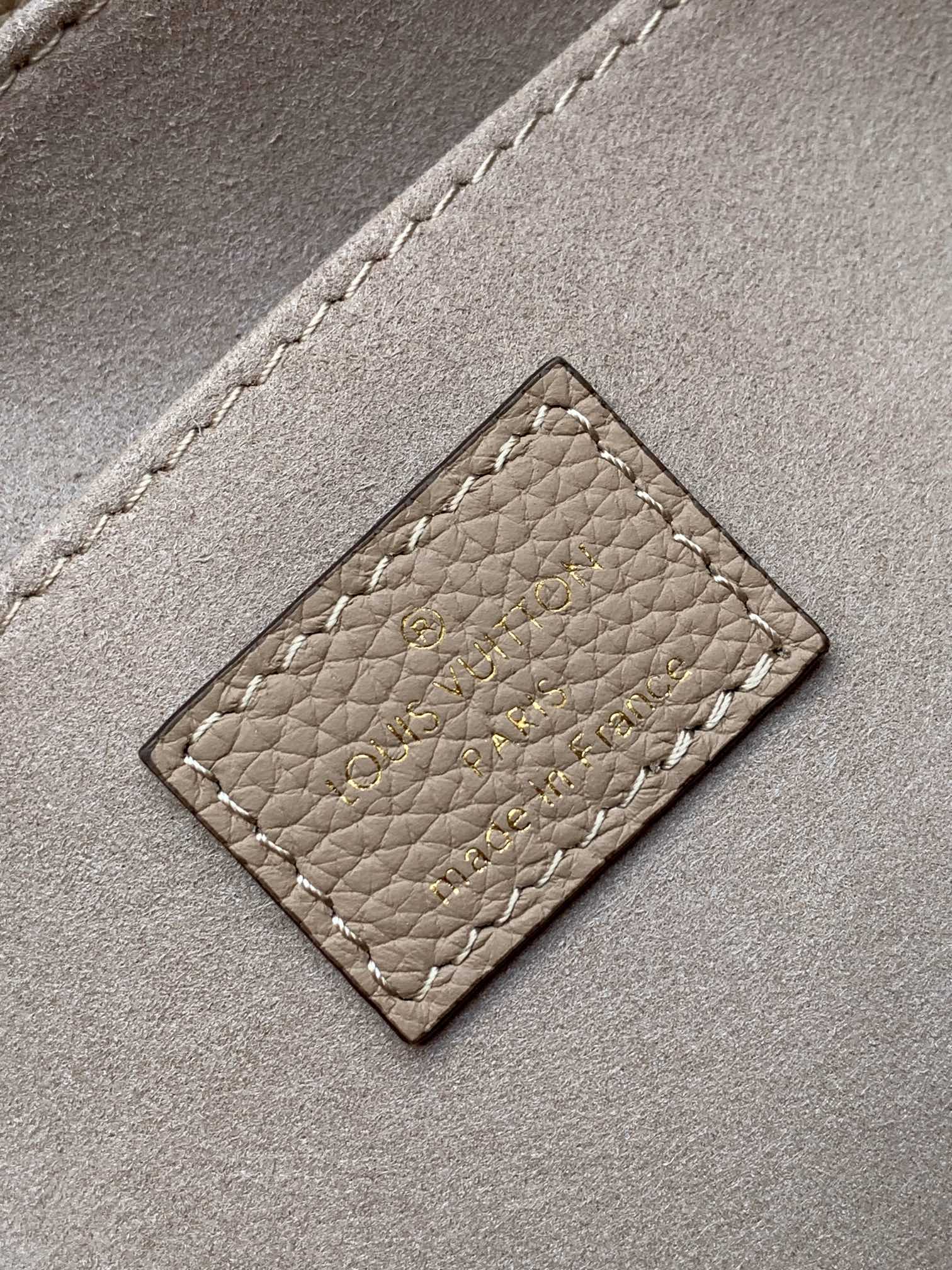 Louis Vuitton Elegant Beige Monogram Embossed Leather Top Handle Handbag