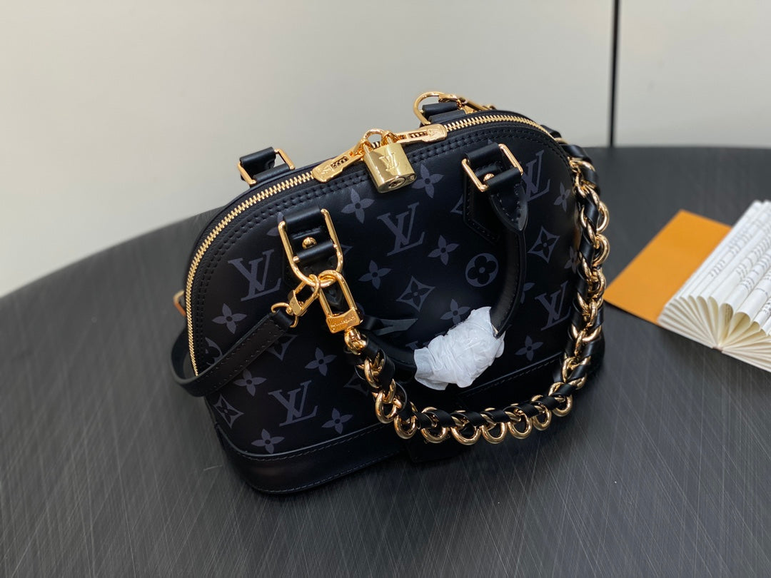 Louis Vuitton Elegant Black Embossed Leather Dome Satchel with Gold Chain