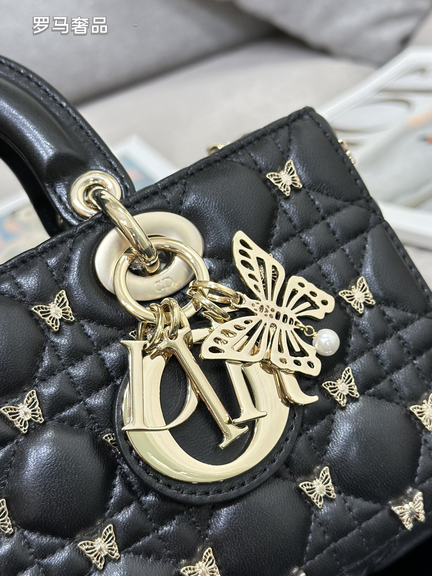 Dior Luxury Black Quilted Leather Top Handle Bag with Gold Butterfly Charm