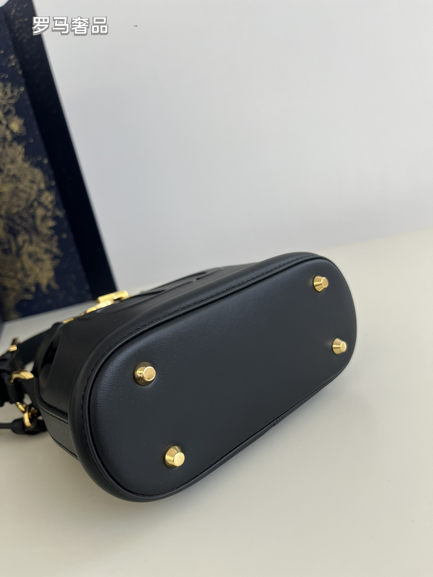 Dior Elegant Cream Leather Bucket Crossbody Bag with Gold Chain