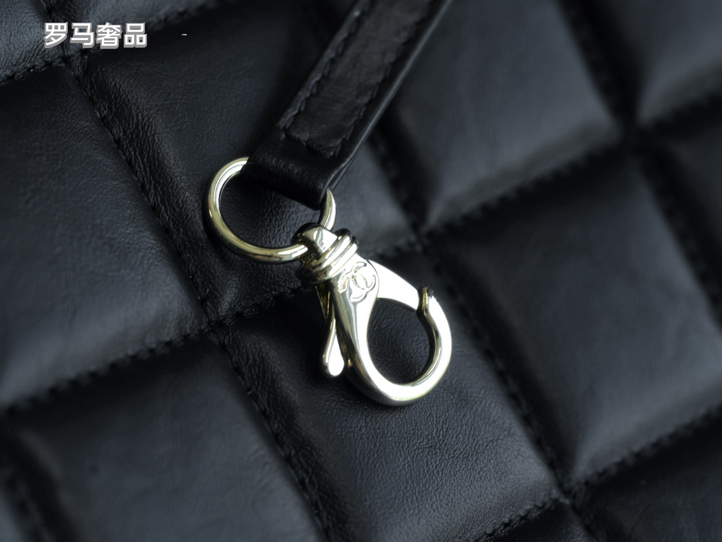 Luxury Black Quilted Leather Handbag with Gold-Tone Chain Strap and Cut-Out Handles