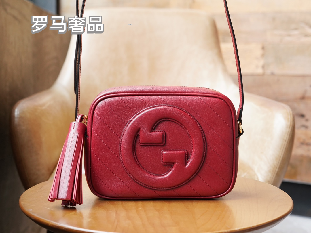Gucci Red Leather Crossbody Camera Bag with Embossed Logo and Tassel