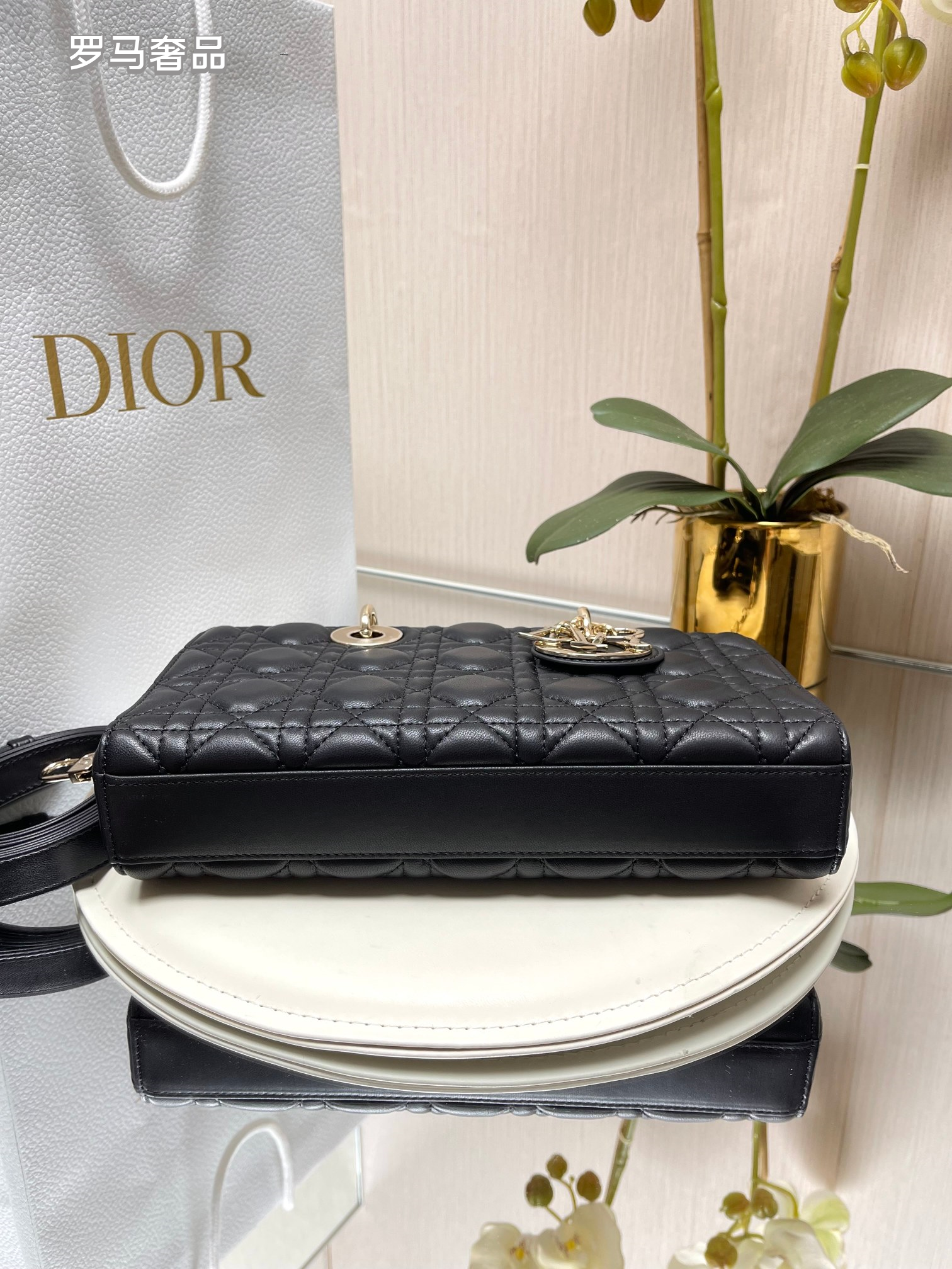 Dior Black Quilted Leather Handbag with Top Handle and Gold Chain Strap